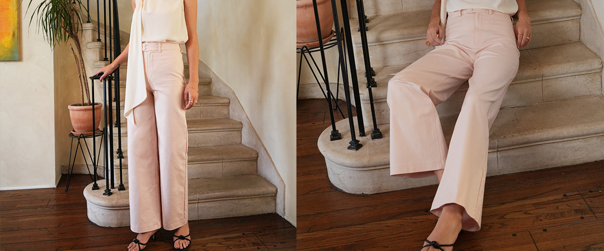 Up-close image of white, high-waist trousers being worn.