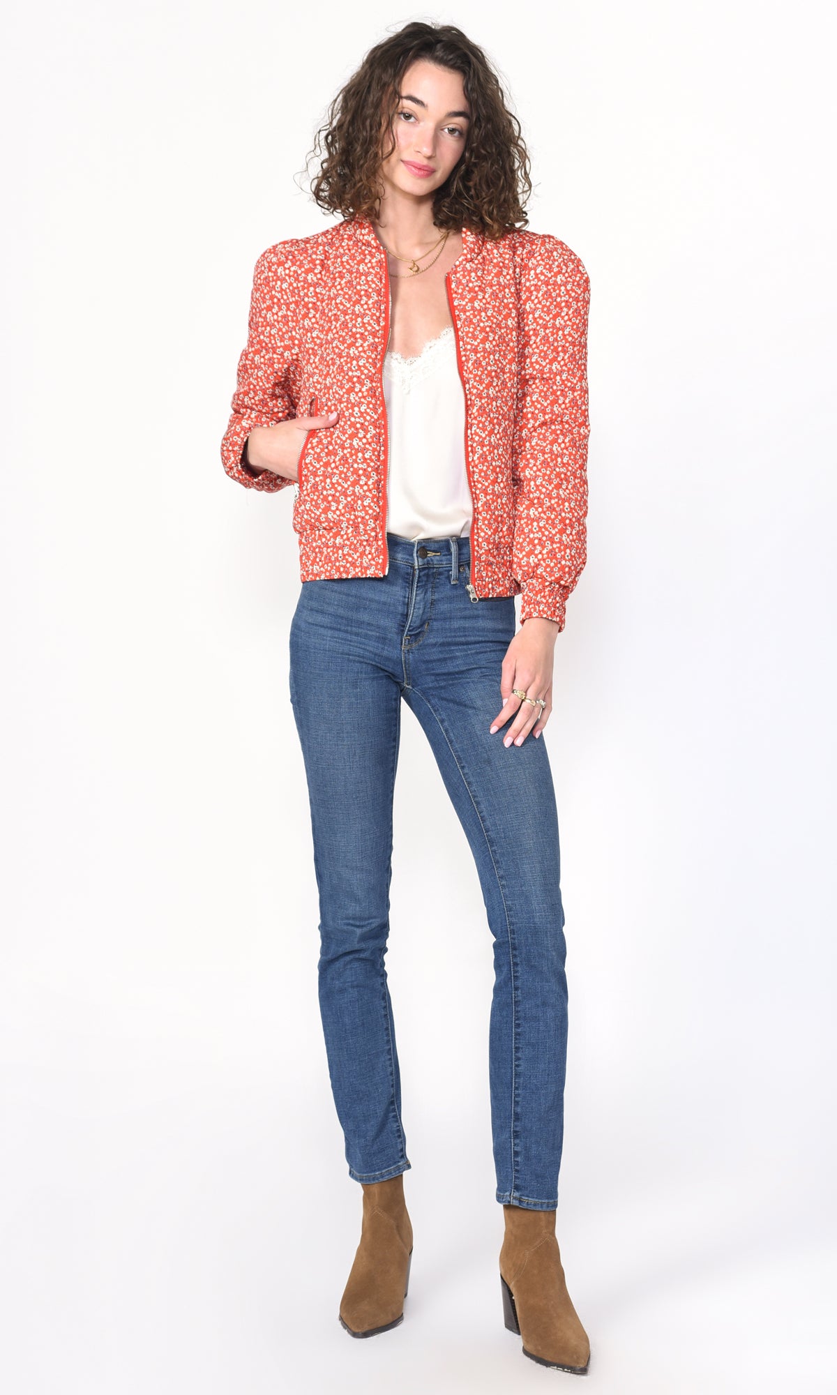 Simone is wearing a bomber jacket made from floral jacquard knit